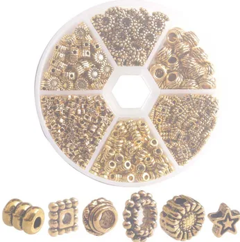 En Kasse med 480PCS Antiqued Guld Metal Star Rør Pladsen Spacer Perler til smykkefremstilling